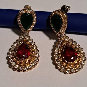 Tear drop shaped gold tone earrings with red, green and diamond like stones